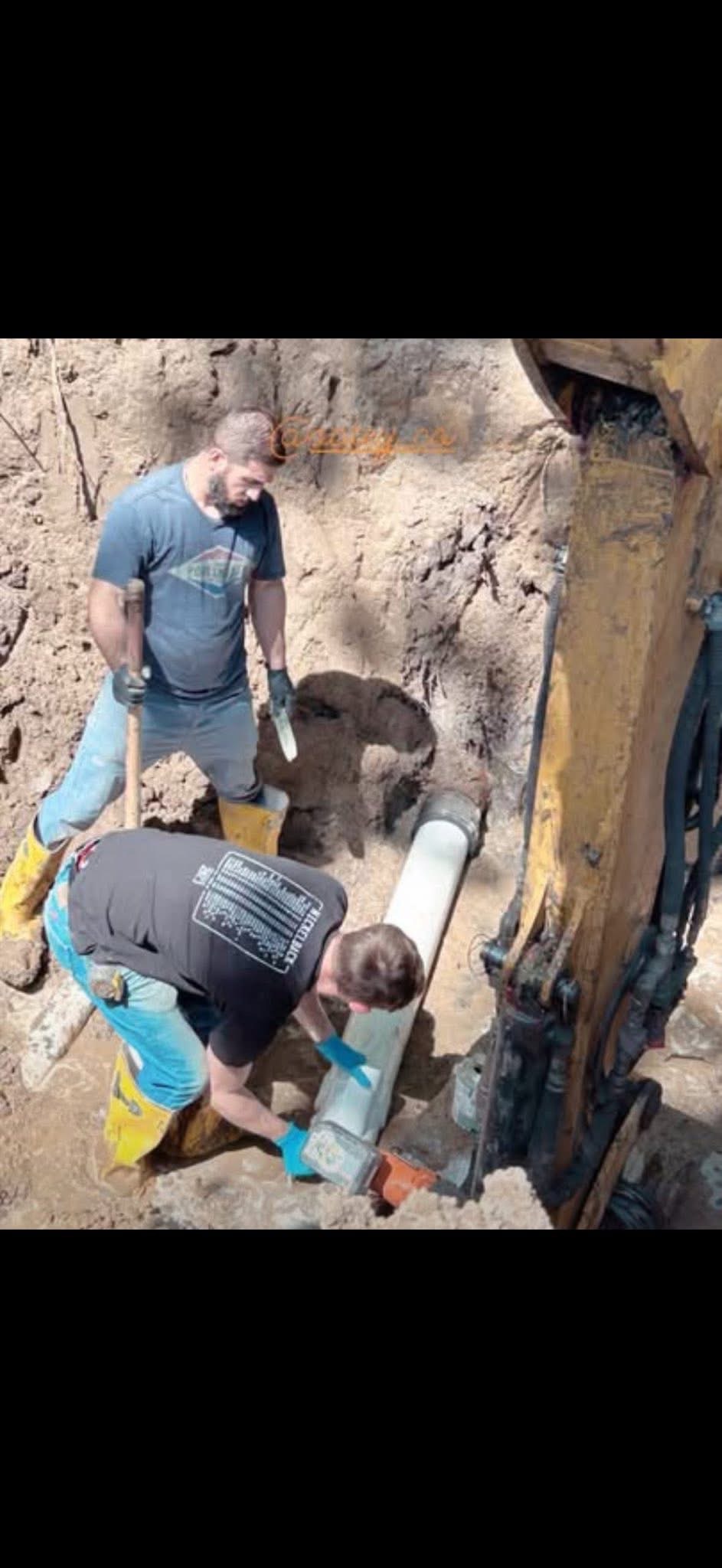 Trent's Plumbing crew working on sewer line excavation